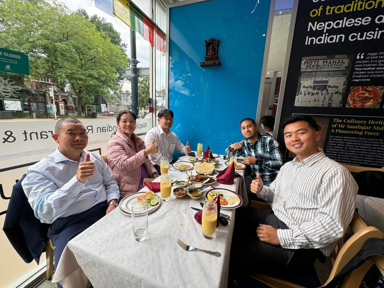 Guests at a window table at The Original Third Eye